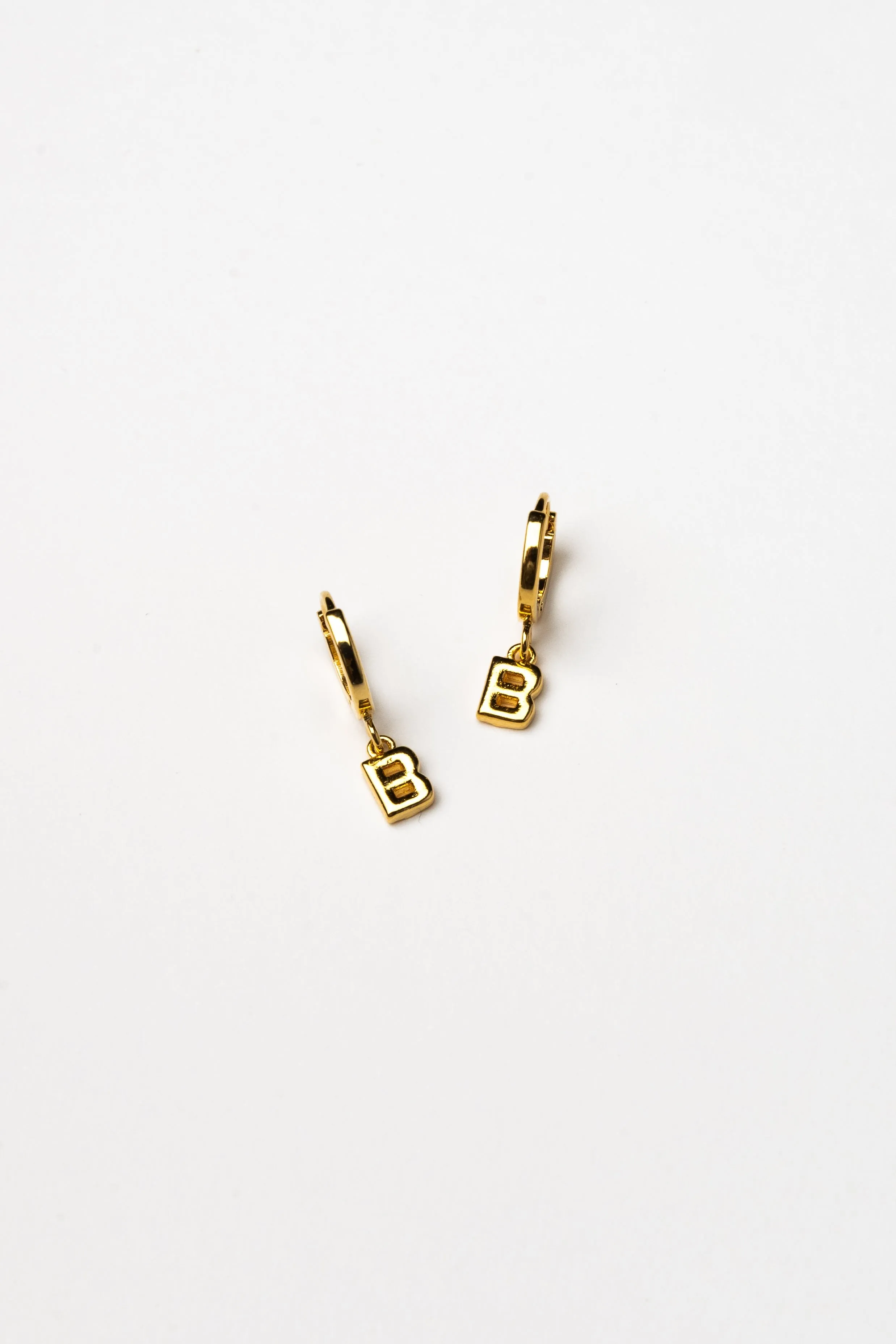 Cove Initial Letter Huggie Earrings