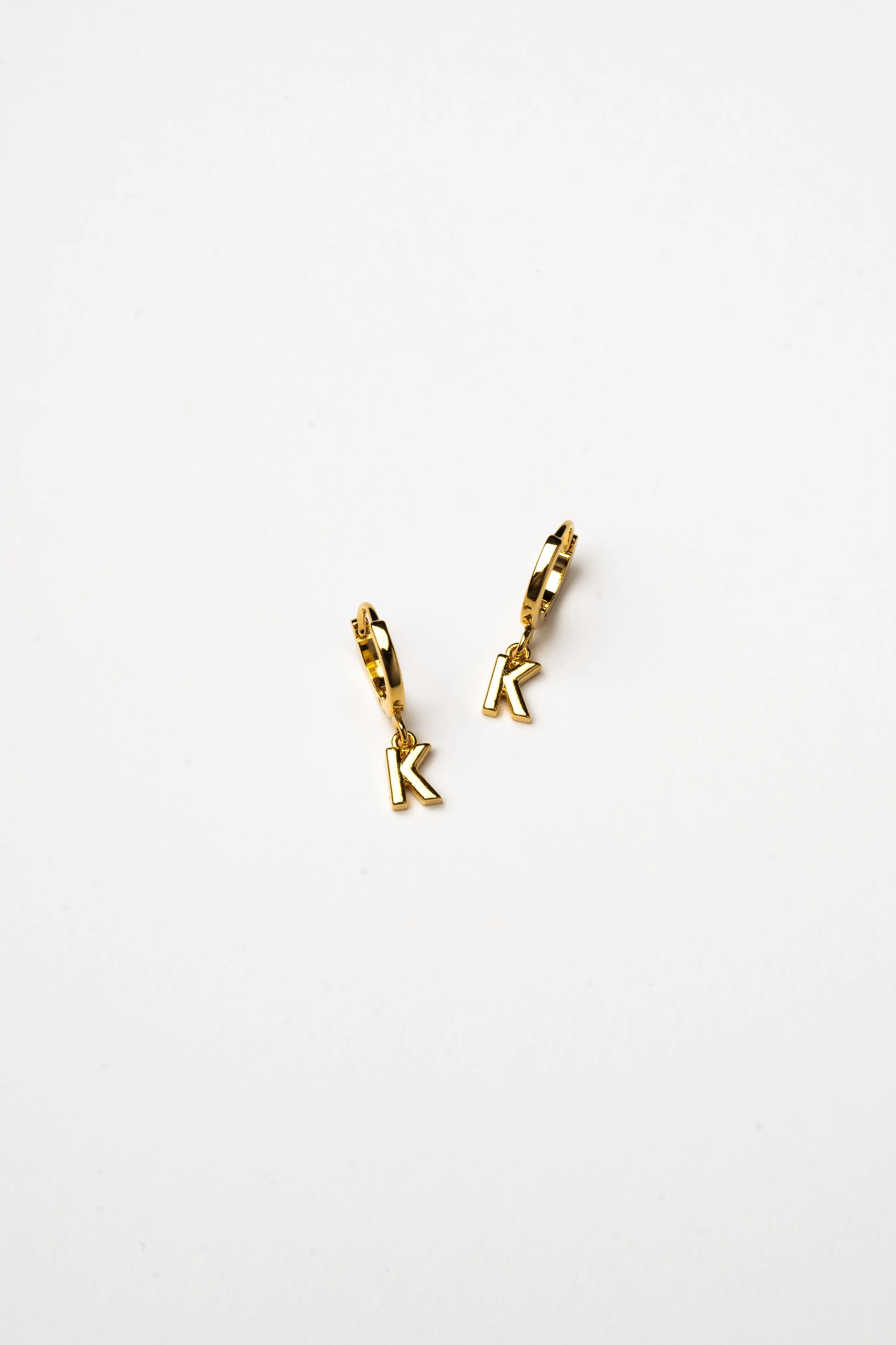 Cove Initial Letter Huggie Earrings